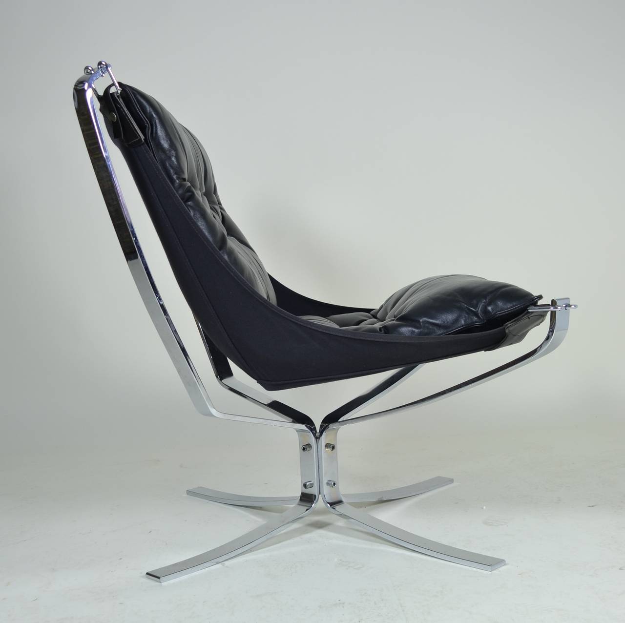 Designed for Vatne Mobler by Sigurd Resell in 1974, the Falcon chair. Super comfortable. This example is in excellent condition. Black leather upholstery and heavy chrome base.