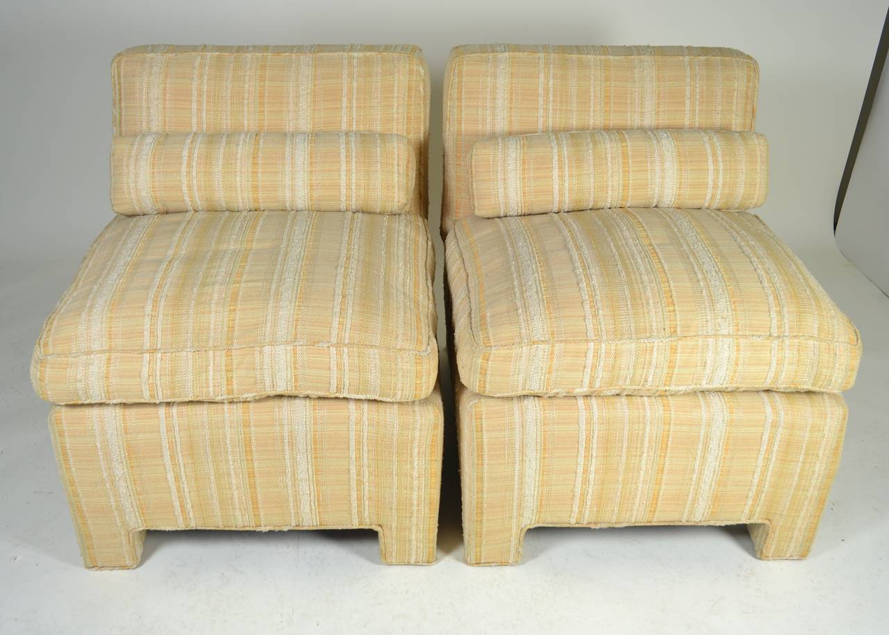 Handsome pair of fine quality slipper chairs, very comfortable. Purchased from Bloomingdales in the late 1960s. Original cover of textured cotton is very good condition with very little wear. Loose seat cushion fiber/feather.