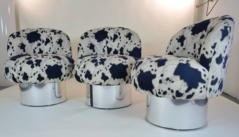 Comfortable and cool, swivel chairs on chrome bases with simple black stripe detail. Currently covered in designer ultra-suede in a dark blue and black design.
Three available. $1,100 each, or $2,900 for all three. 27