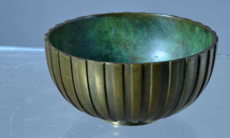 Finely crafted bronze bowl with patinated finish interior. Signed TINOS BRONCE Denmark. FInely cast with fluted interior and patinated interior.