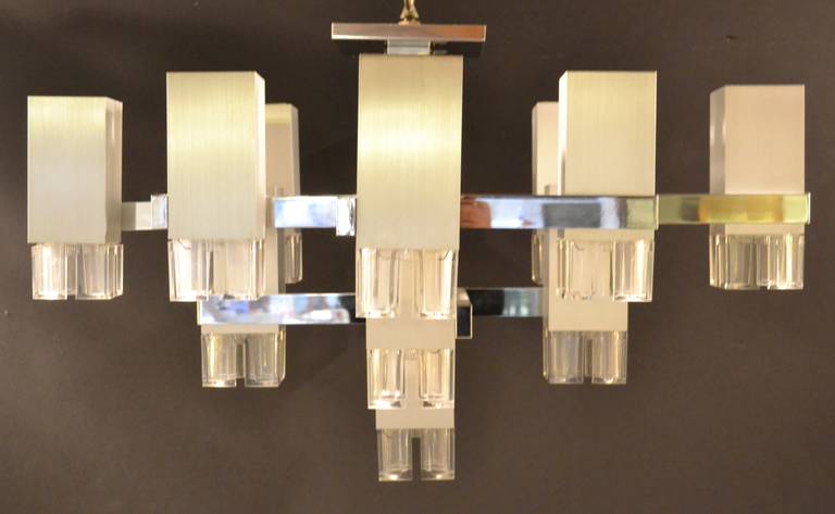 Polished chrome and brushed finish chandelier by Gaetano Sciolari circa 1970. Features 17 lights. Large diameter of 33