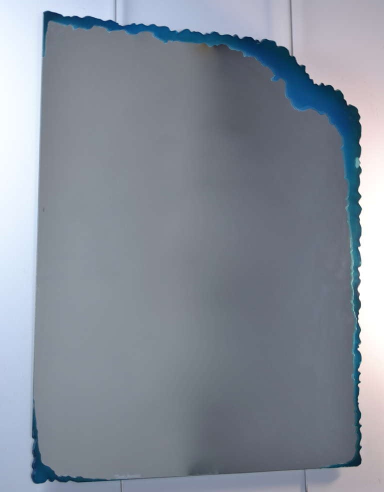 Fun, funky wall mirror with a free form art glass edge. Etched signature.