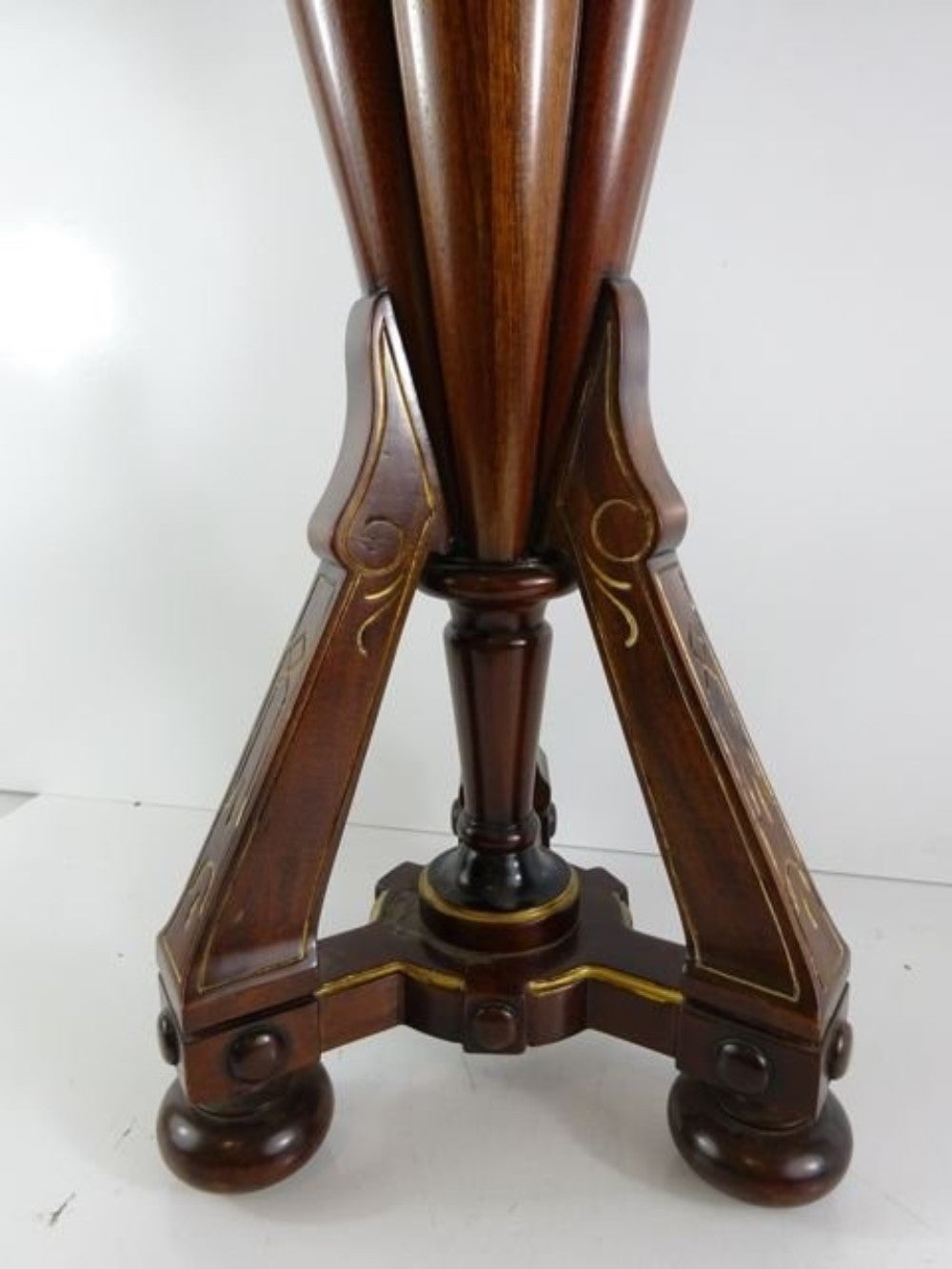 Umbrella stand in an Victorian style. Made with mahogany and brass with a bronze handle