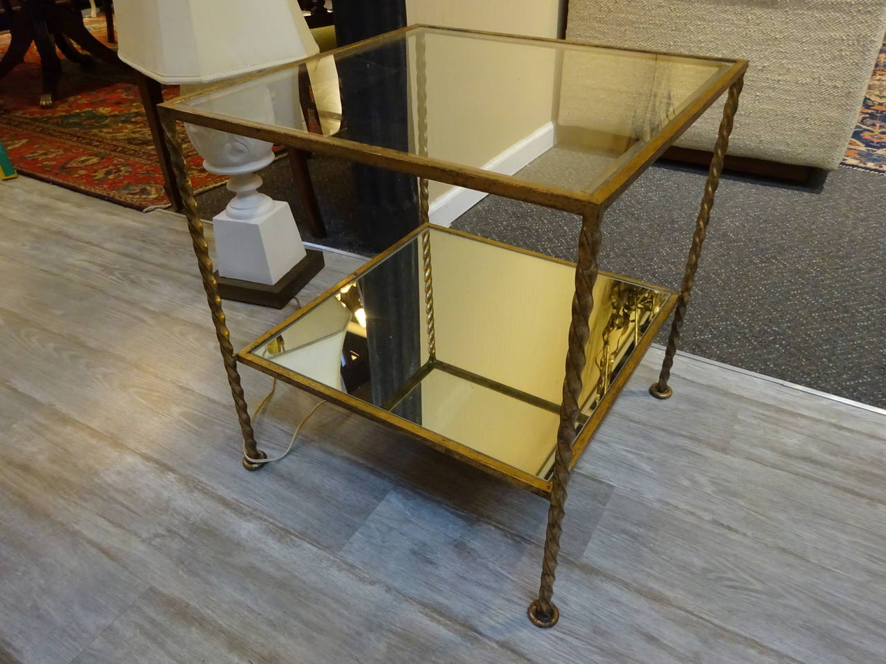 French Modern Gilt Metal Two-Tiered Cube Table,  with interchangeable clear glass top and mirrored bottom.