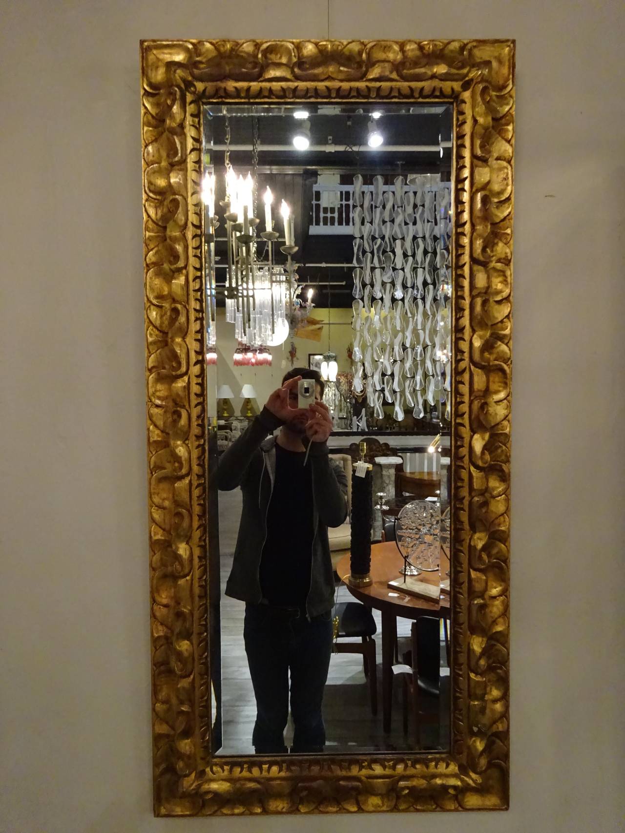 Pair of Carved Giltwood Mirrors, each one of rectangular form with beveled mirrors