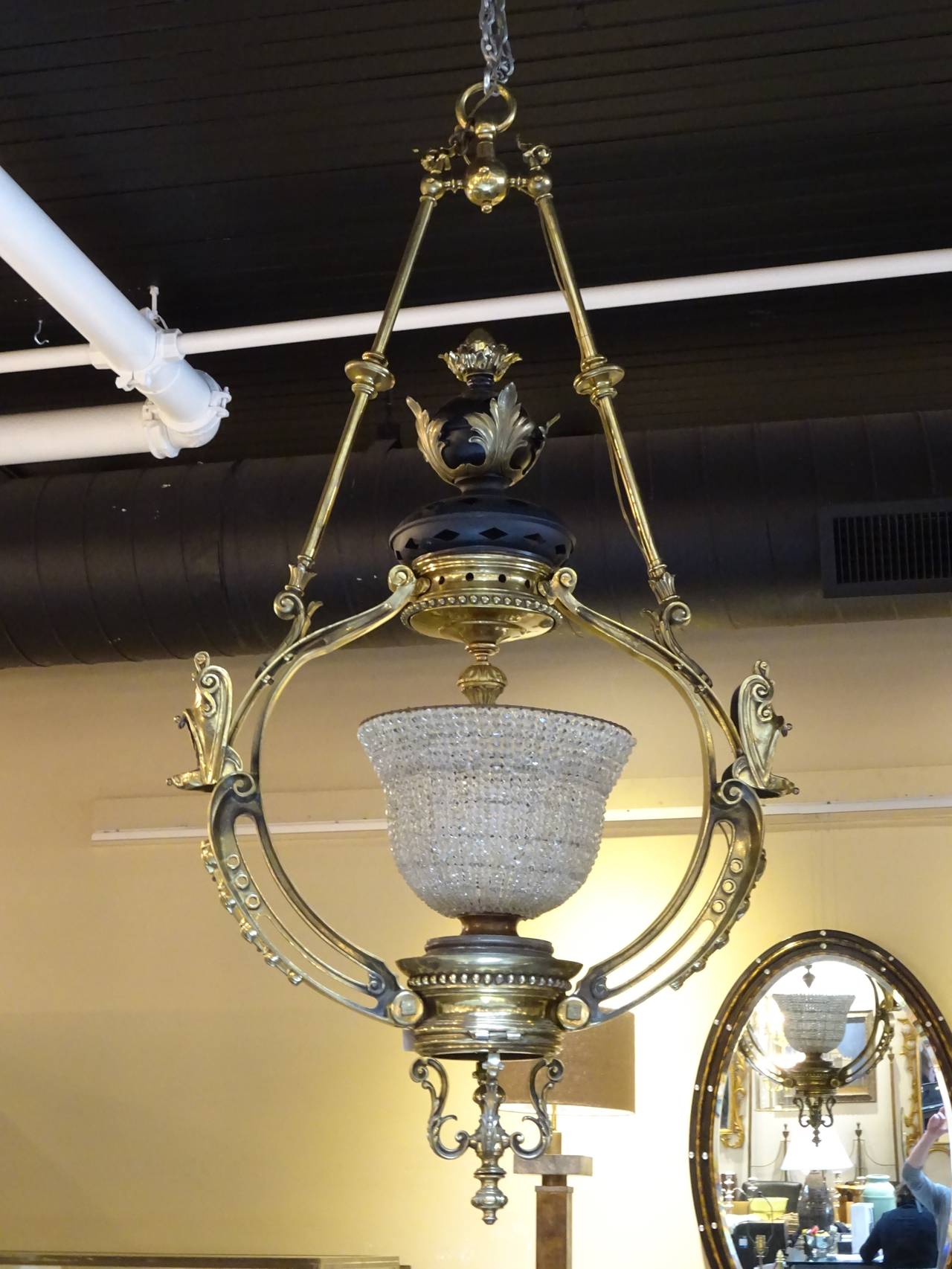 Massive Victorian bronze chandelier attributed to F&C Osler, of suspended circular form, with central beaded crystal urn.