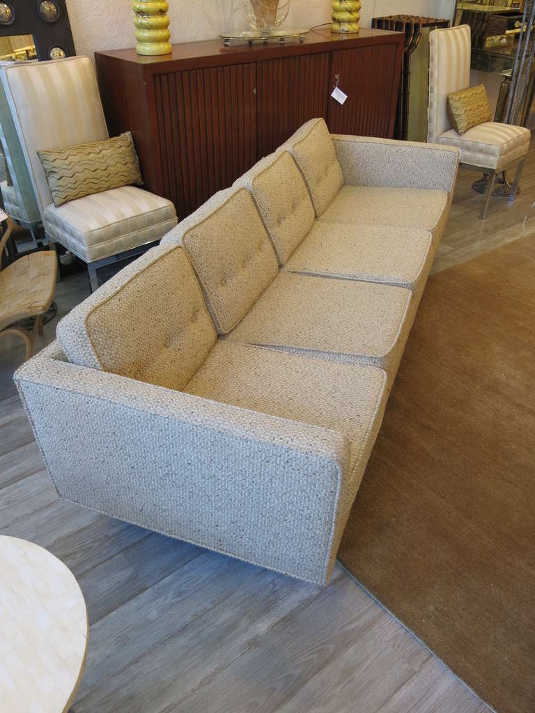 Each with four top and bottom cushions, raised on six mahogany legs. Recent custom wool upholstery.