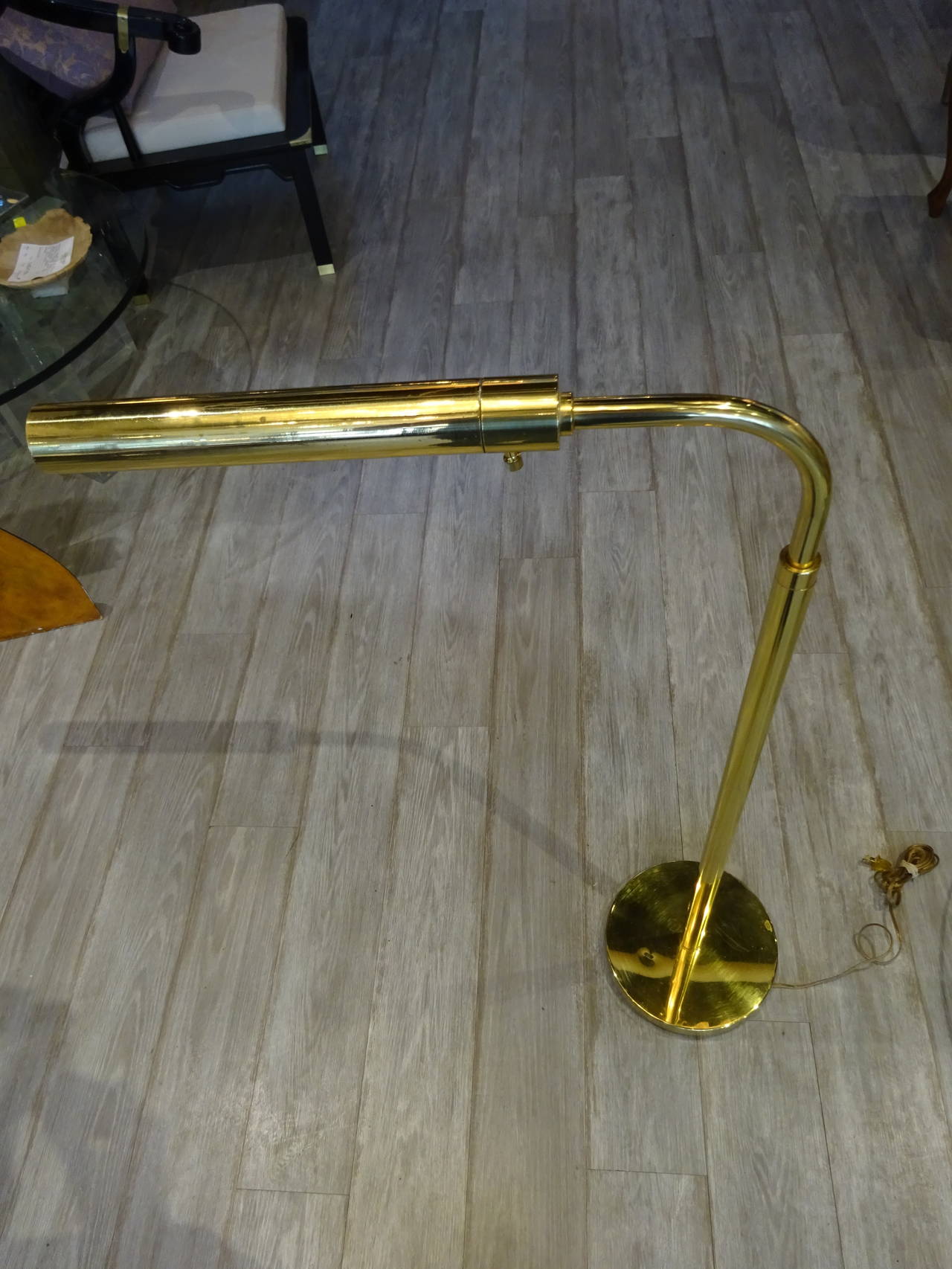 Mid Century Modern Brass Adjustable Floor/ Reading Lamp, of typpical form.