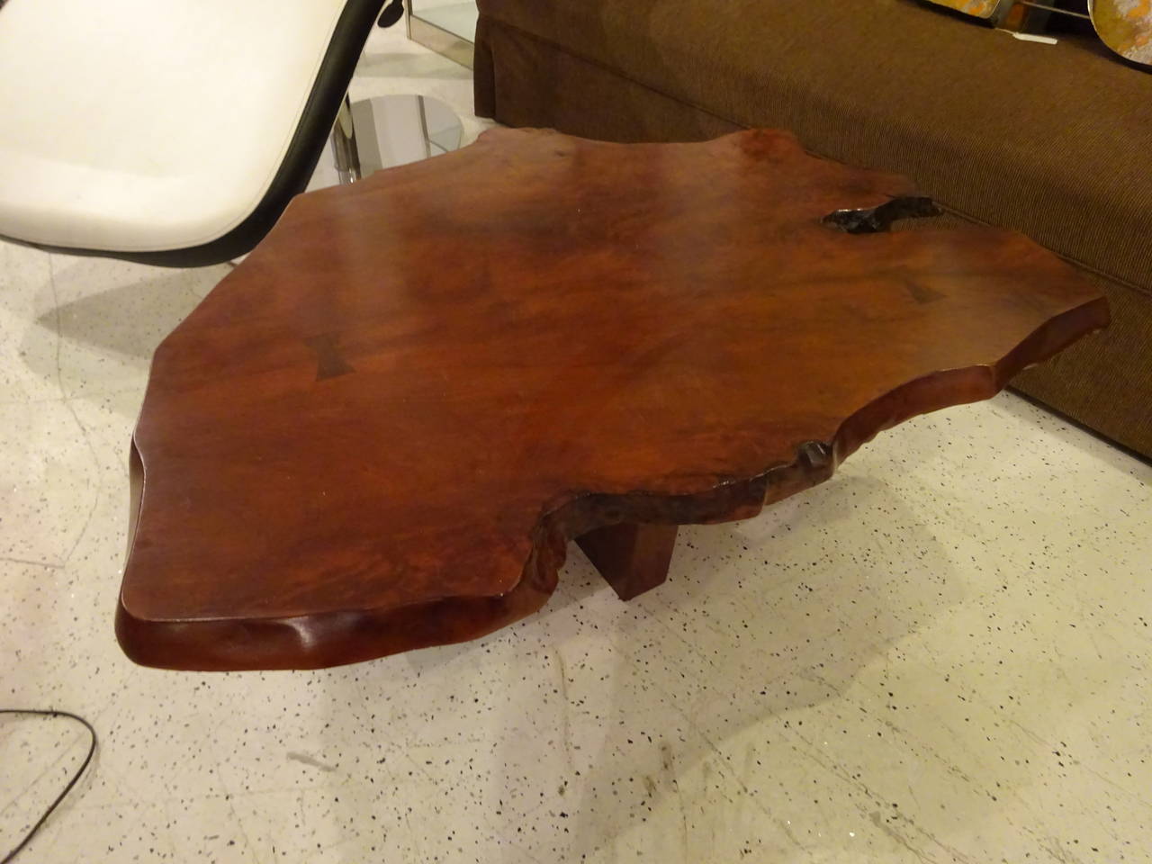Nakashima Style Coffee Table, of typical form organic slab top with butterfly dovetails, raised on trestle base