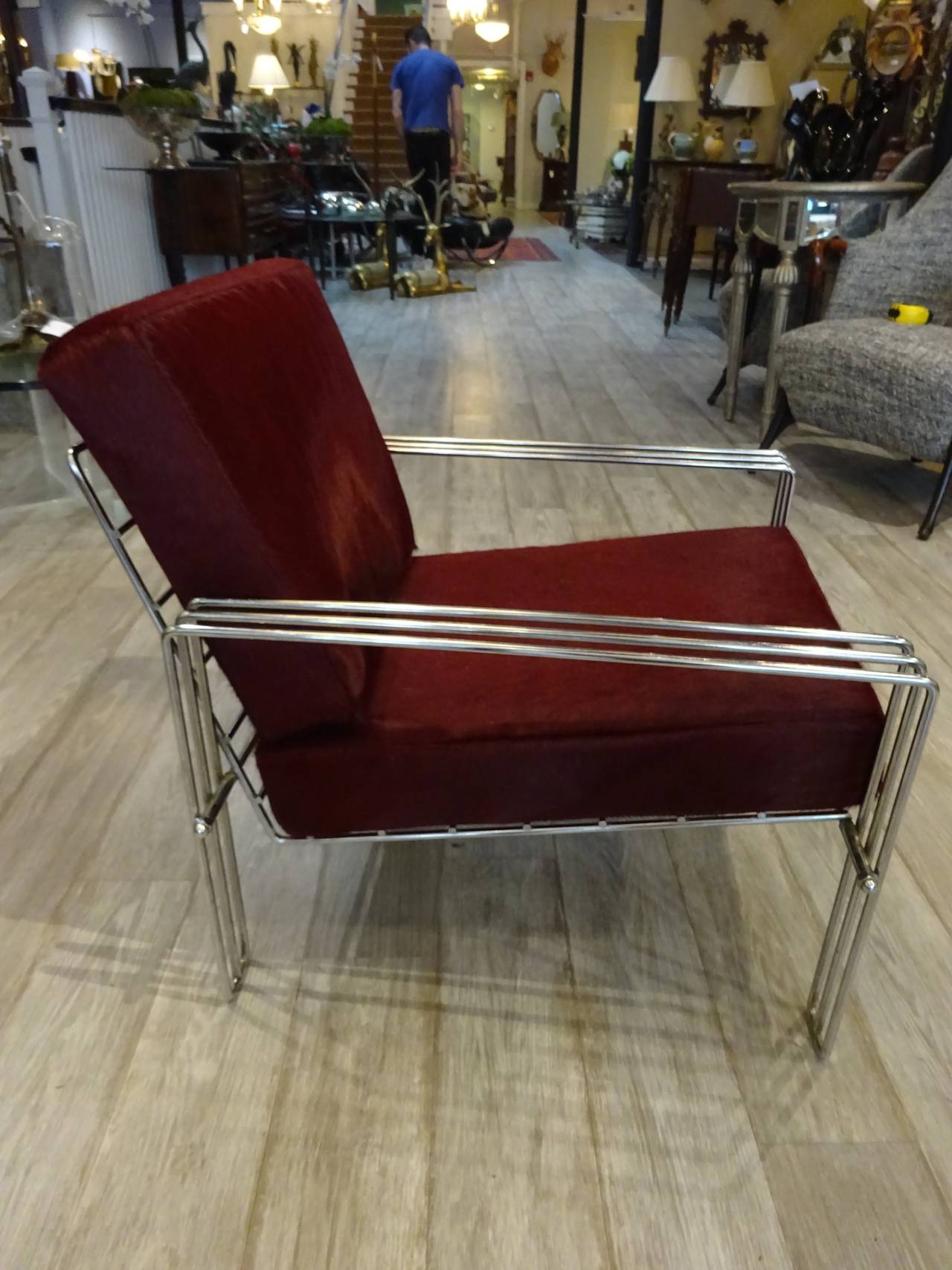 Pair of Italian design chrome and pony hide club chairs, each one of architectural design, with rectangular dyed pony hide upholstered back and seat.