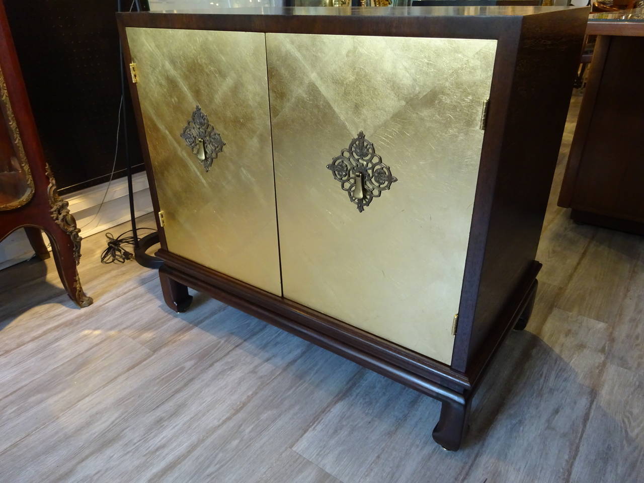 Mid-Century Modern Pair of John Stuart Gold Leaf Cabinets For Sale