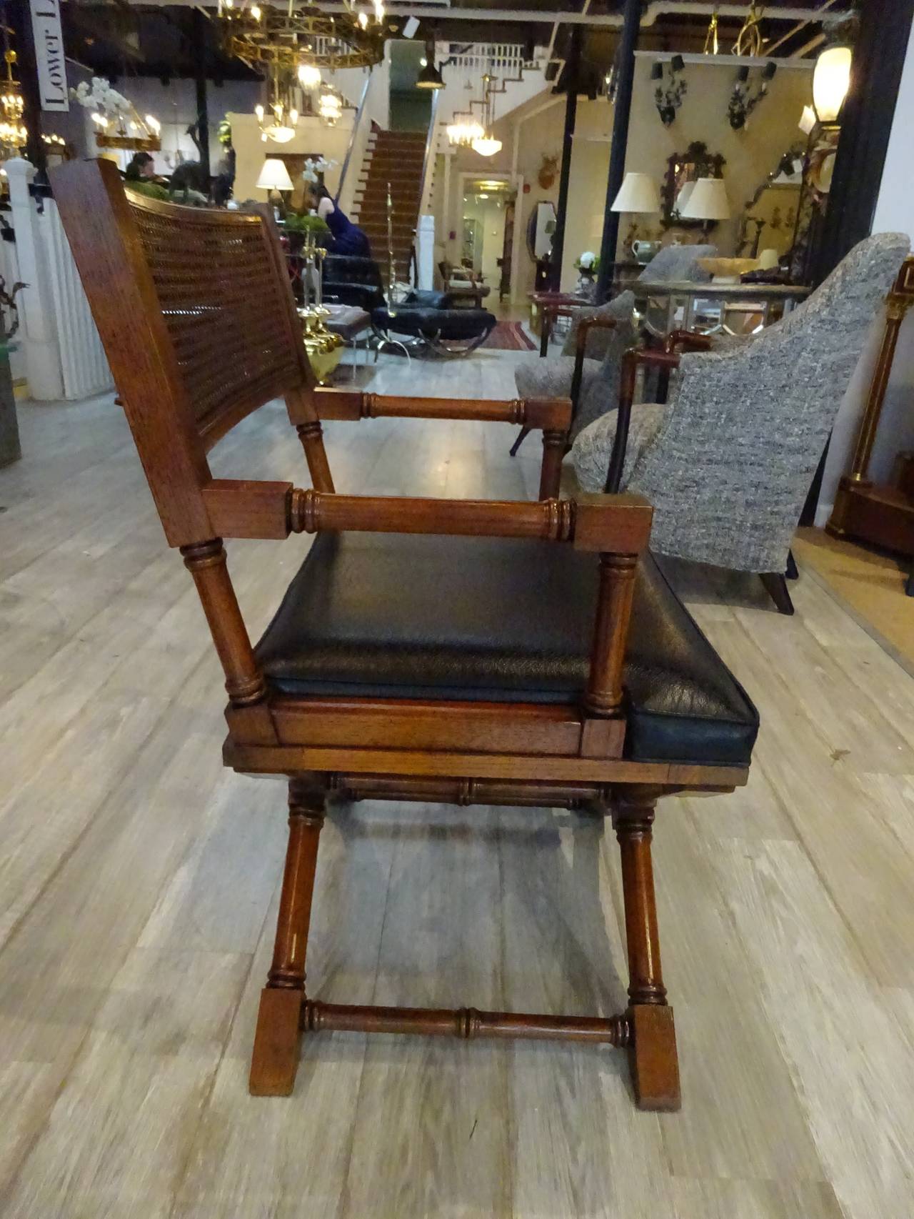 Pair of Mid Century Campaign Chairs, of typical form with cned back rests and upholstered seats