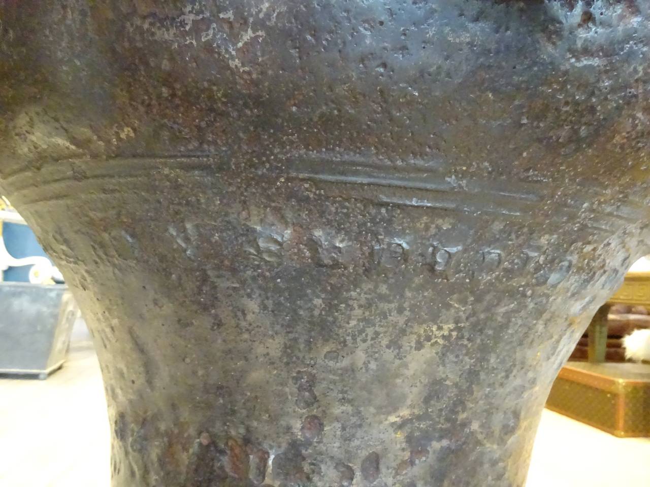 Large French 18th century or older bronze bell, mounted on a later bronze and marble square plinth. Can be used as a table base or planter, decorated with now illegible rows of relief script. Weighs about 300lbs.