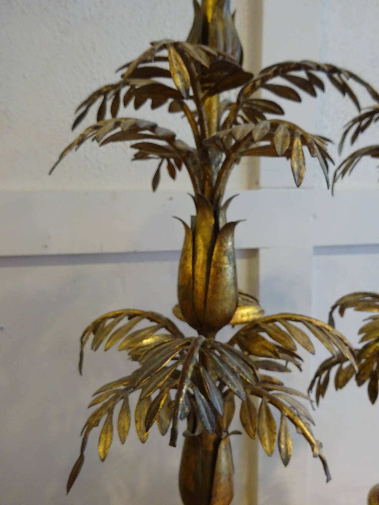 Pair of Gilt Metal Palmette Lamps, each one two tiers of stylized palm motif raised on a gilt wood pedestal, probably made by Borghese