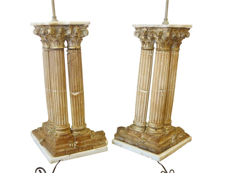 A pair of Grand Tour style Carved wood columns fitted with Marble, Great Scale and detail.This item is located in our Lambertville showroom