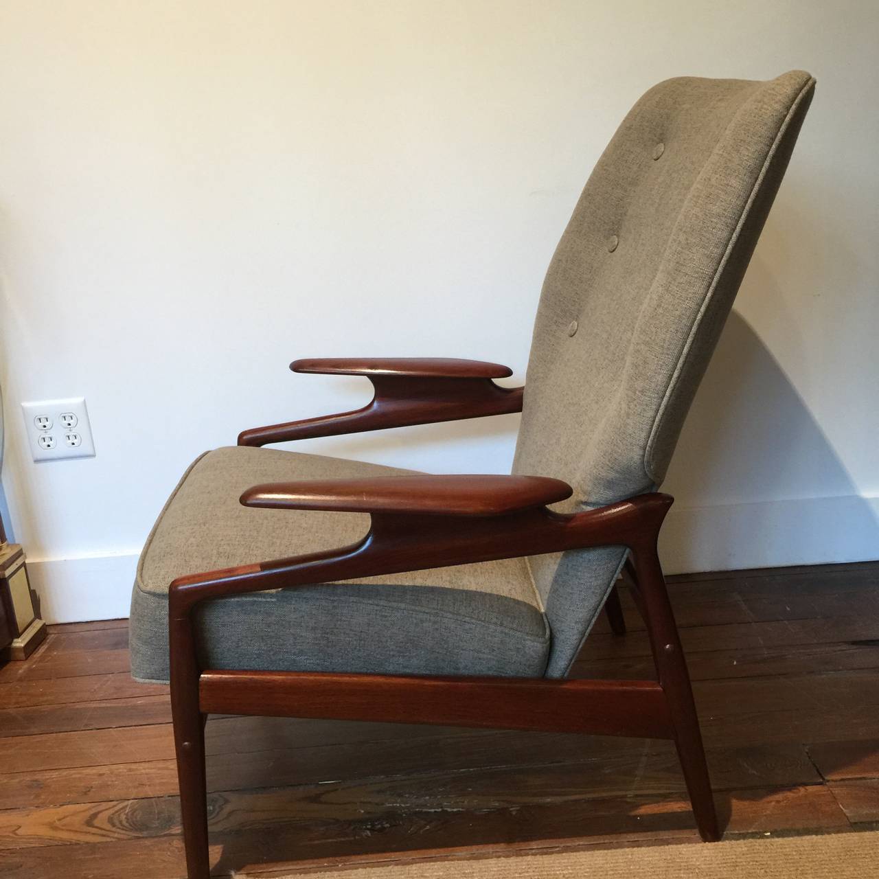 Finn Juhl style reclining lounge chair and ottoman. Has manually operated mechanism under seat. Chair has small brass inlays typical of Grete Jalk or Illum Wikellso construction. Recently upholstered. 
Ottoman measures 25