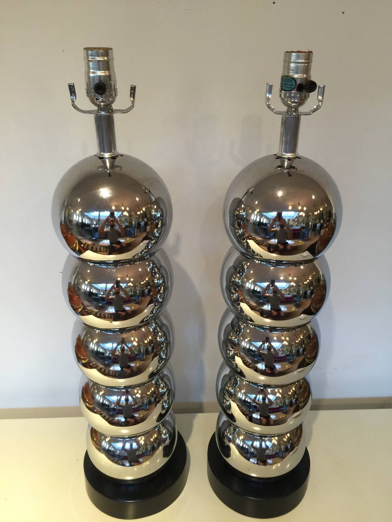 Pair of large chrome ball table lamps by George Kovacs with five stacked spheres and  ebonized wood base. Rewired.
