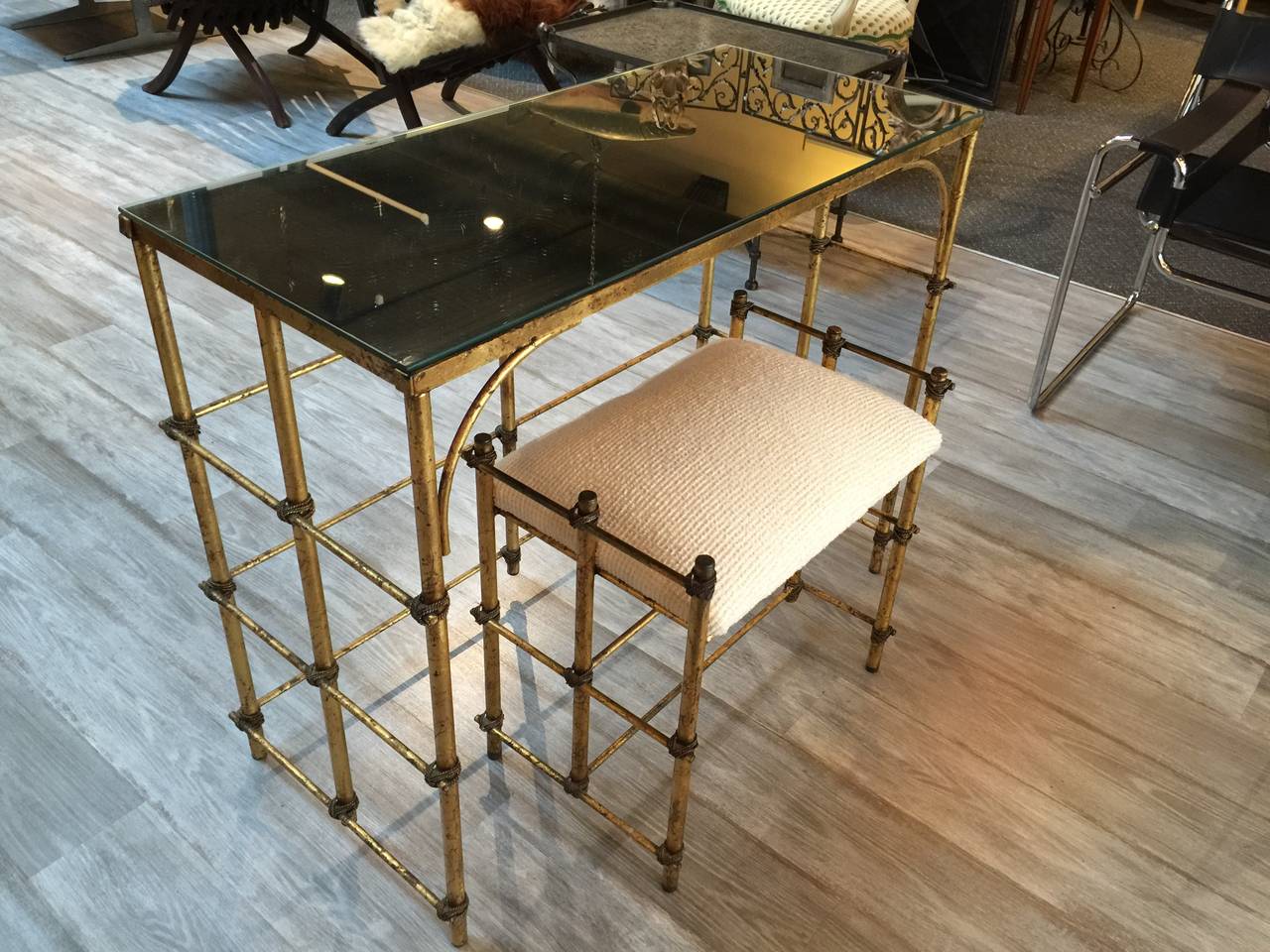 Hollywood Regency Gilt and Mirrored Vanity and Stool, of rectangular from with mirrored top on a lower case of trellis gilt metal 