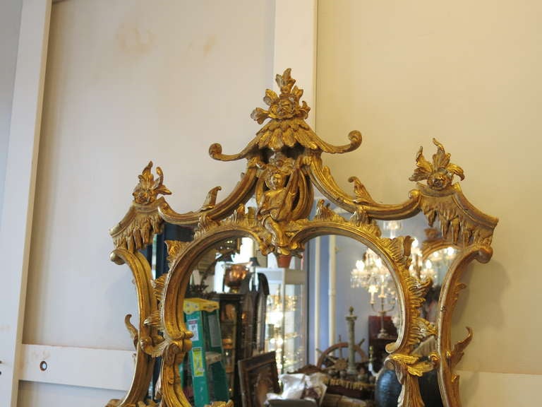 A Superb pair of Cabinet Made Georgian Style chinoisere giltwood mirrors. Each one pagoda shaped and fantastically carved  trellis designs. Estate Fresh.
