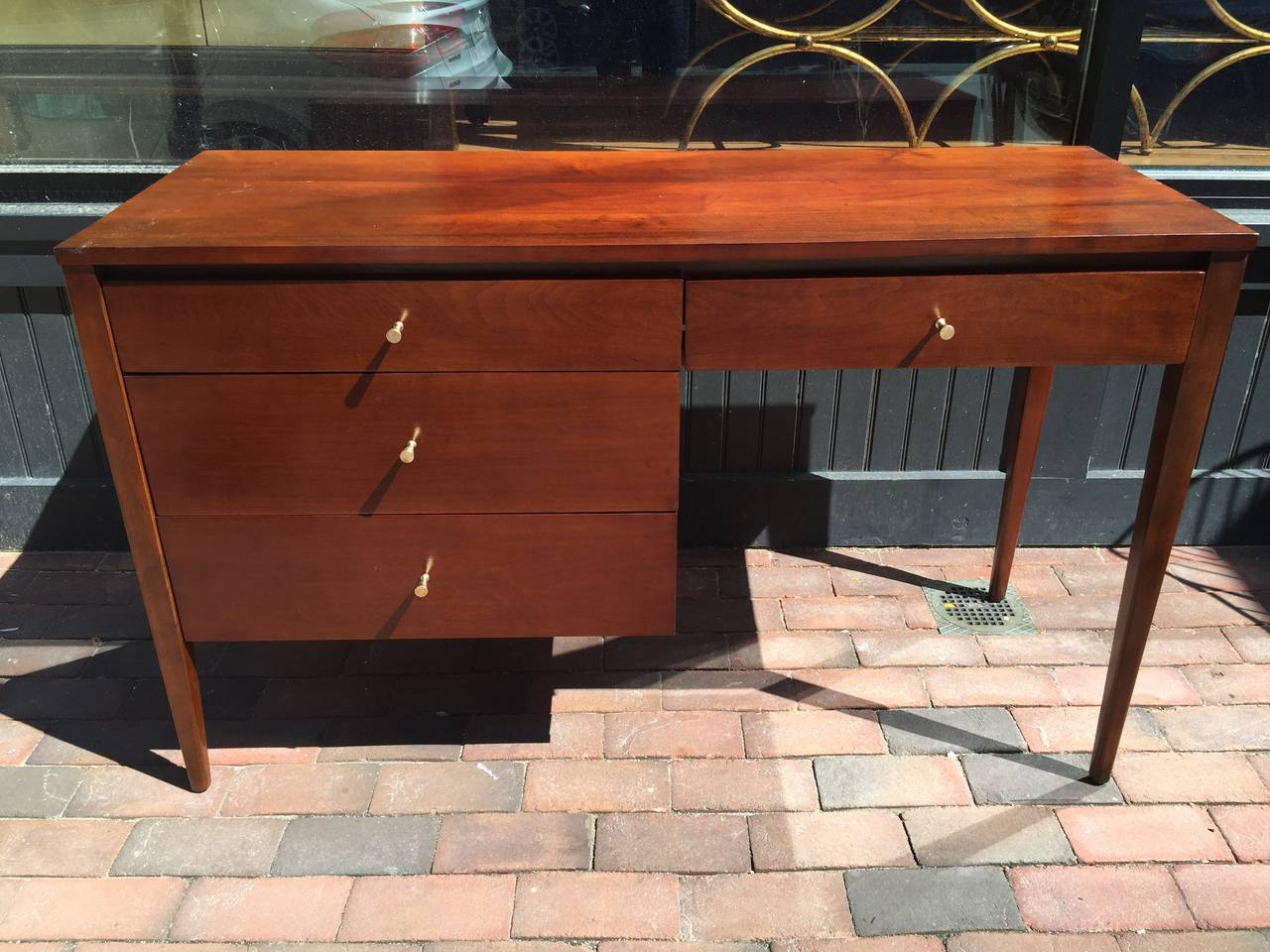 Paul McCobb for Planner Group Desk and Chair
Of Rectangular form, fitted with four drawers, retains original chair. 
The birch has been stained a deep rich walnut
Chair measures: 30.75"H x 20"W x 17"D and 17" seat height.