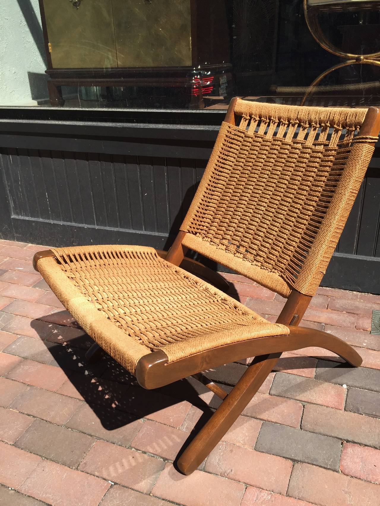 Hans Wegner Style Folding Chair, of typical form with intricate rope woven seat and backrest