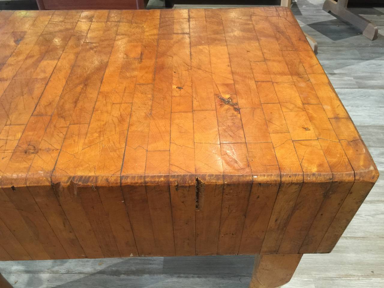 Large American Butcher Block, of rectangular form with multiple inlaid segments, raised on four tapering legs raised on wheeled castors, From a Maryland Farm