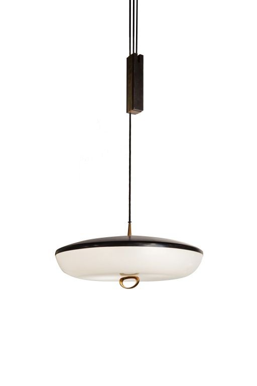 1950s Stilnovo of Italy black enamel, brass and perspex white shade adjustable light fixture. Rewired, original patina on brass. Shade measures 21 in diameter. Height adjustable.