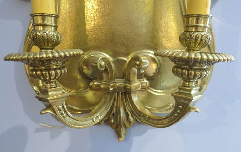 A single regency style bronze two light wall sconce. France, circa 1910
