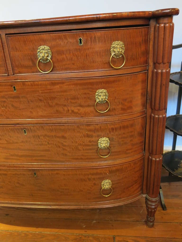 A Classical Carved Mahogany Chest of Drawers, one of two similar examples being offered.
Attributed to William Hook (1777-1869), Salem, Massachusetts, 1800-1815 
The shaped top with outset corners and serpentine front edge above two over three