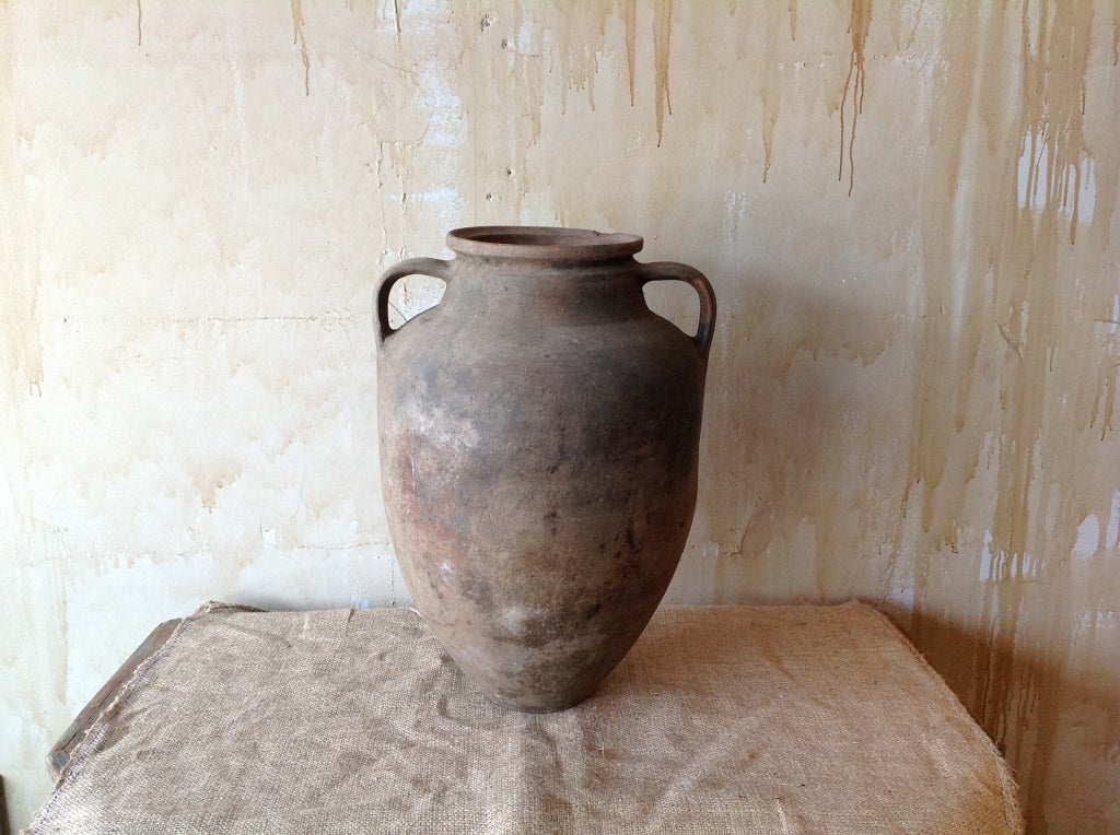 The patina on this beautiful oil jar from Calabria in Italy gives this pot a wonderful rustic look.