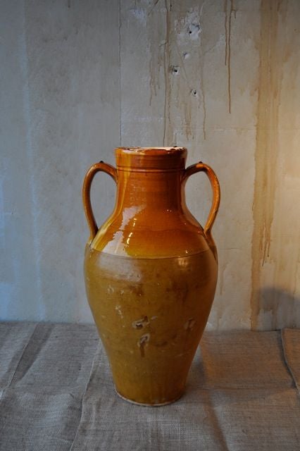 Tall antique terra cotta glazed jar