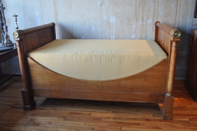 Antique day bed from France.  Empire style.  
New custom frame and mattress.