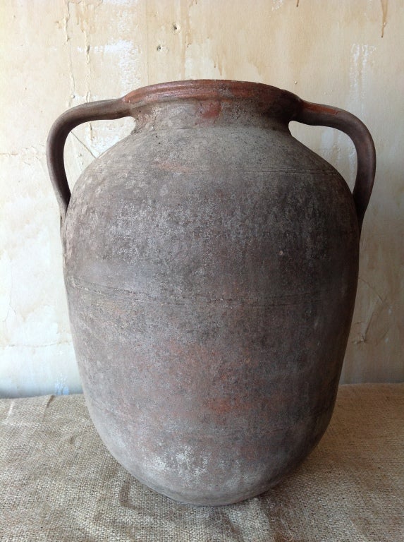 This authentic calabrian oil jar was used to store olive oil in southern Italy.  It is a typical shape for the region and has a nice patina on the glaze.