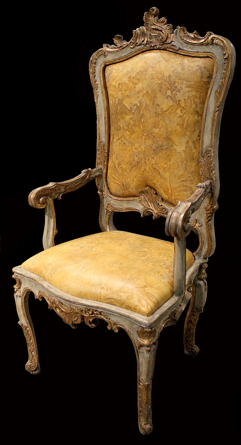 A pair of Italian Louis XV 18th century Venetian polychrome and parcel-gilt fauteil armchairs, exhibiting rocaille motifs and now covered in hand dyed embossed leather.