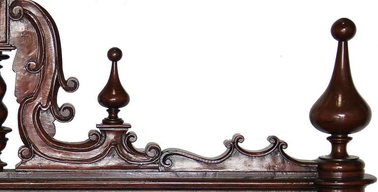 A magnificent 18th century king sized Portuguese rosewood bed with barley sugar twist supports and bedposts topped with finials, and with the headboard composed of three levels of spiral twisted spindles.
