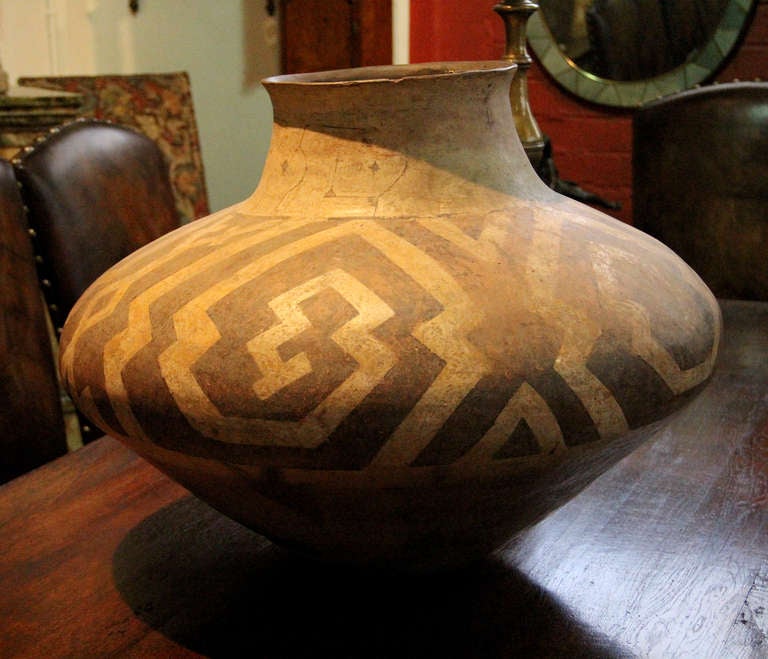 An 18th c. Peruvian Zibibbo clay urn decorated with primitive geometric motifs