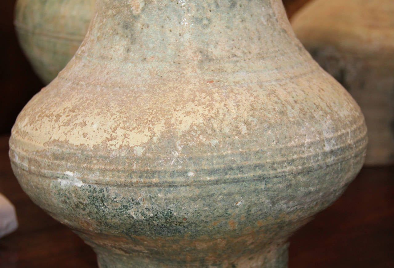 Two Chinese Han dynasty glazed earthenware jars also known as "Hu", meaning jar in Chinese, used for storage of wine, oils and assorted commodities likes grains.