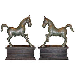 An Unusual Tribal Pair of Solid Bronze Cantering Horses