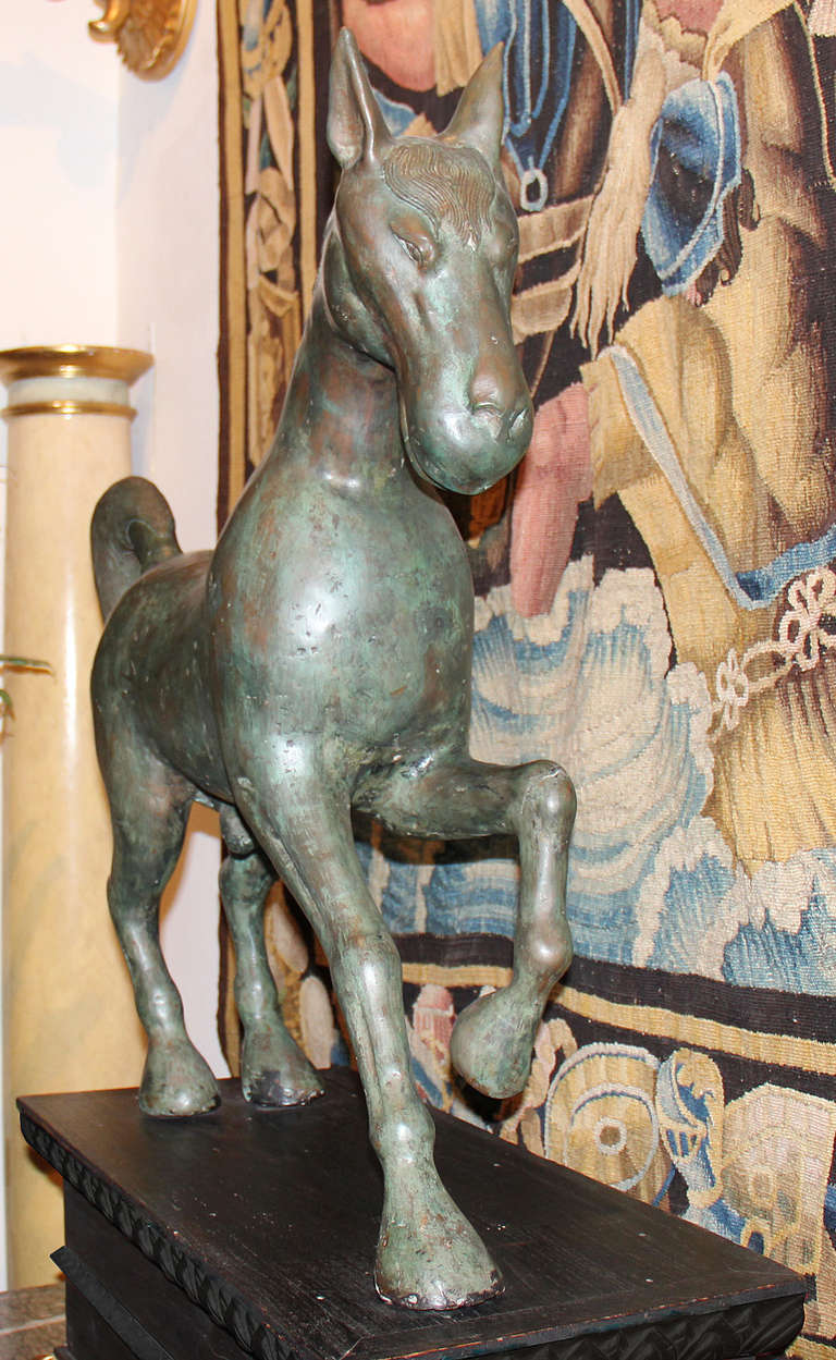 An Unusual Tribal Pair of Solid Bronze Cantering Horses from the the Eastern Half of the Byzantine Empire and dating from the first Golden Age of Byzantium, both solid bronze with super patinas, each horse being different (two different models were