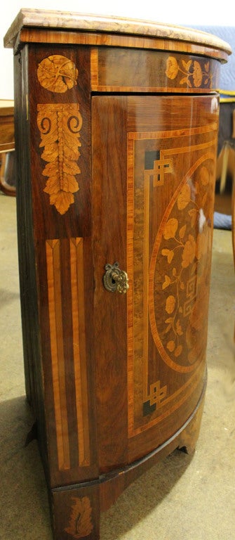 A French 18th c. Marquetry Corner Cabinet