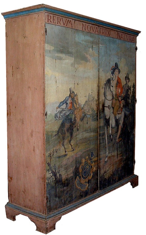 A unique 18th century provencal polychrome Italian armoire, with two doors sans traverse depicting a lush pastel scene of an aristocrat out for a ride on his country estate (Rerum Novatrix Natura) with his entourage and preparing to dismount onto a