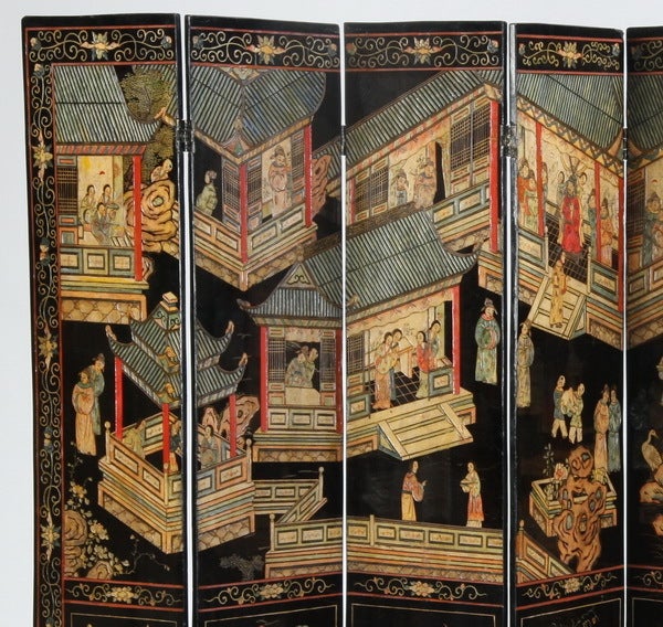 Early 20th century Chinese 8-panel carved and polychrome lacquered double-sided coromandel screen depicting figures in garden pavilions over a frieze of vases within a floral and scrollwork border.