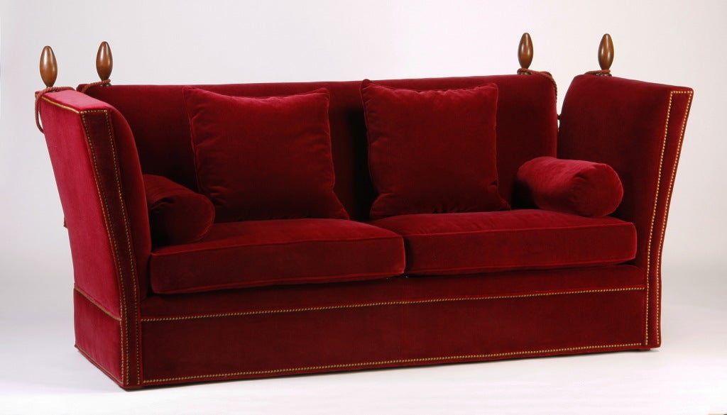 20th century Knole style sofa upholstered in red velvet.
