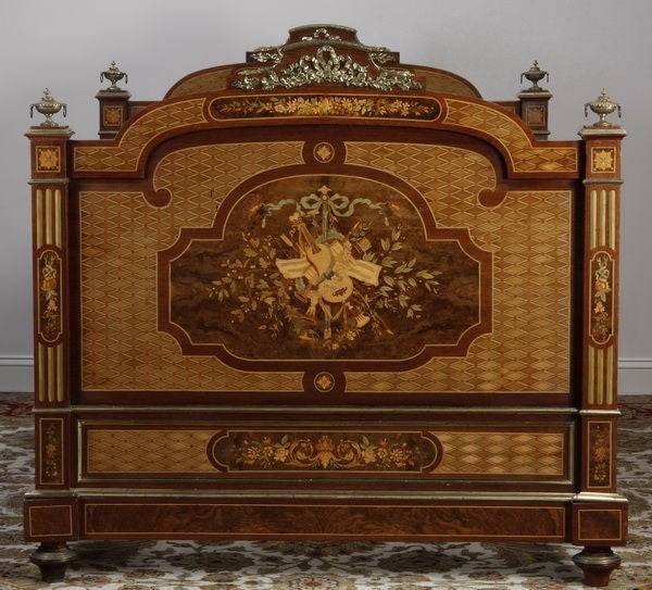 19th century French Empire center-of-the-room style daybed, with extensive parquetry and marquetry inlay and intricate bronze mounts on both the headboard and footboard, side rails also inlaid.  Headboard and footboard each: 55