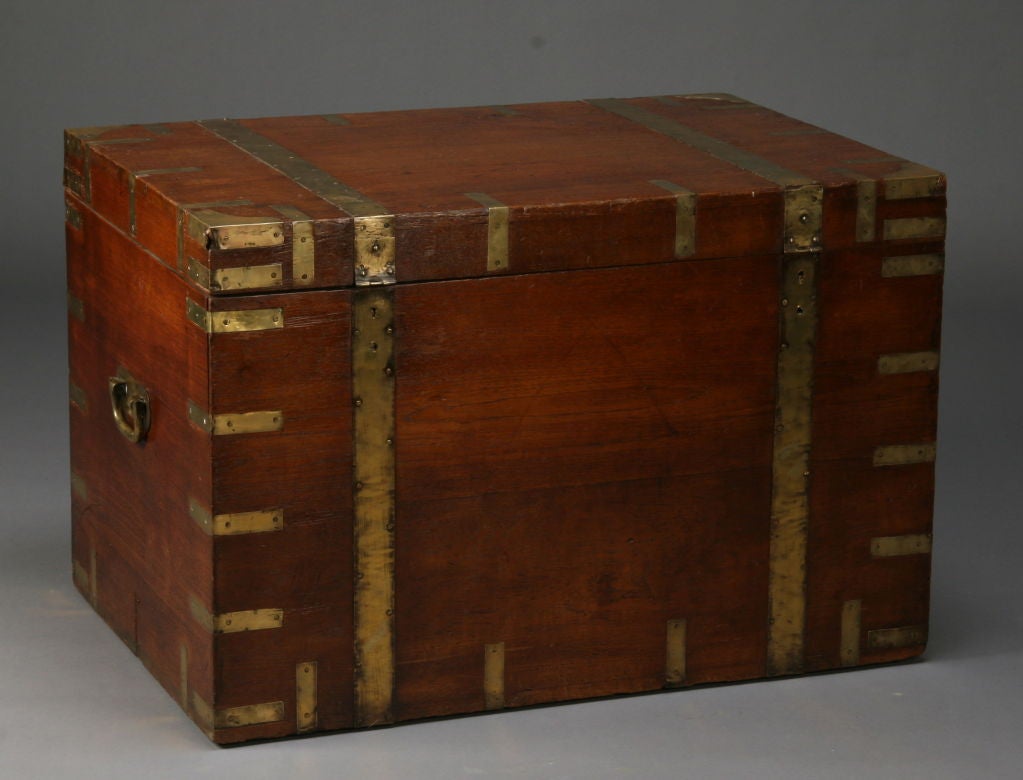 Early 19th century campaign trunk with brass bound strapping used in the field campaigns of British military officers.