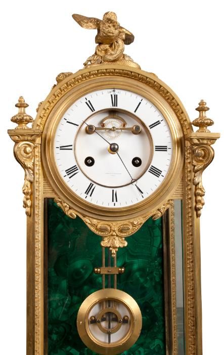 A French ormolu and malachite neoclassical style mantel clock, signed. 