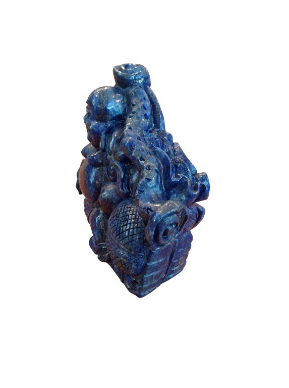 Laughing Buddha, carved lapis lazuli(sometimes abbreviated to lapis) is a relatively rare semi-precious stone that has been prized since antiquity for its intense blue color.

Lapis lazuli was being mined in the Badakhshan province of Afghanistan