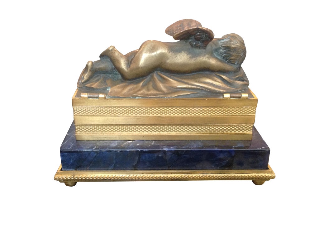 French bronze casket with a resting putti, original restored condition, new blue velvet lining. 

Originally $ 5,000.00.

Lapis lazuli was being mined in the Badakhshan province of Afghanistan as early as the 3rd millennium BC,[2] and there are