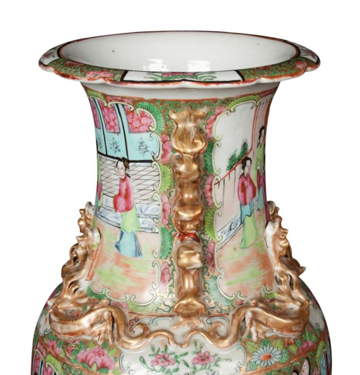 A pair of Chinese porcelain Famille rose vases.  Famille rose known in Chinese as Fencai or Ruancai, meaning 'soft colours', and later as Yangcai, meaning 'foreign colors' was introduced during the reign of Kangxi (1654–1722), possibly around 1720.