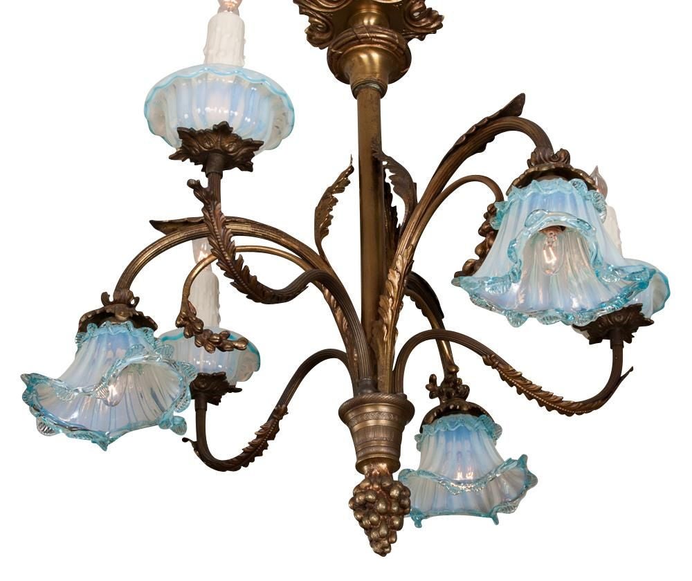French gilt bronze six arm hanging fixture with delicate hand-blown Venetian glass shades having three arms facing up with three facing down, newly wired

Originally $ 2,850.00

PLEASE VISIT OUR SITE FOR ADDITIONAL SPECIALS